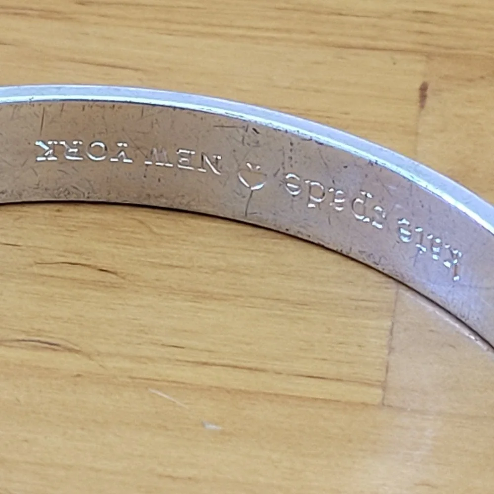 KATE SPADE Be Mine Idiom Silver Tone Engraved Bangle Bracelet